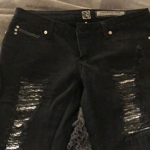 Black jeans with ripped silver patches!